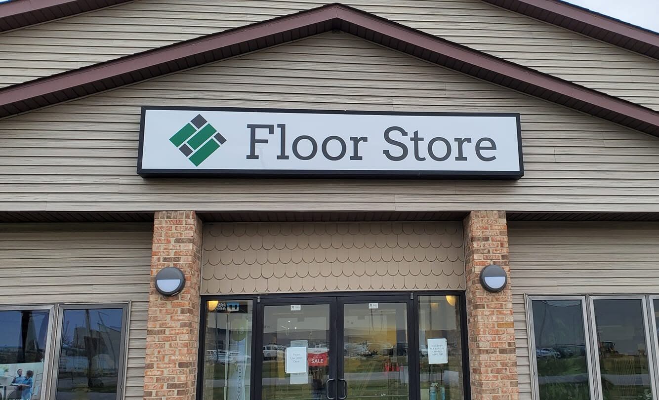 Floor Store sign and logo above the front entrance of the store
